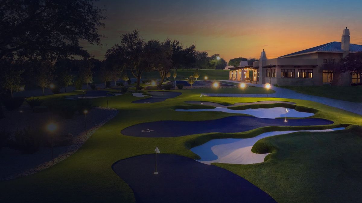 Arcis Golf clubhouse and greens at dusk