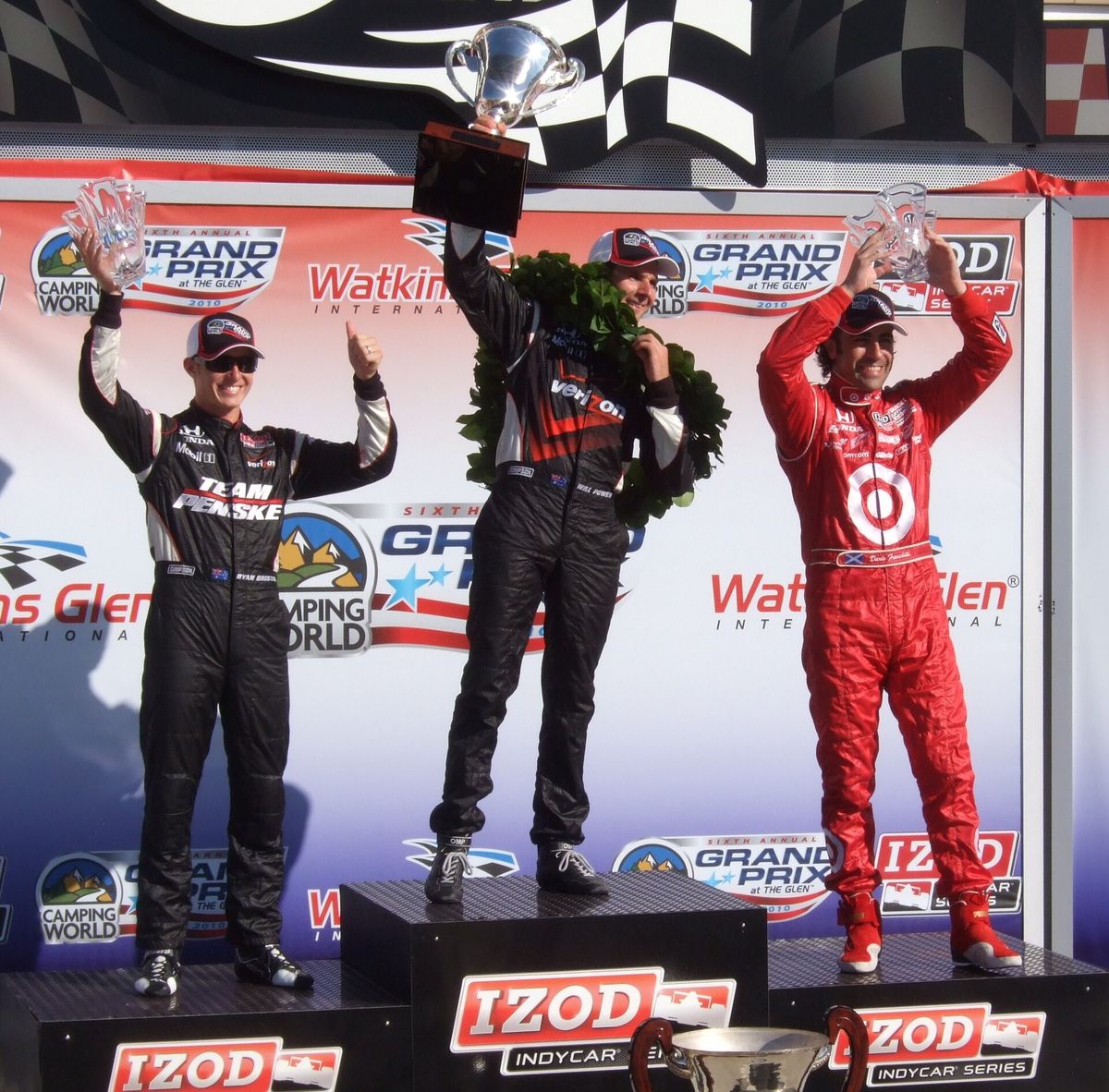 IndyCar drivers on the Victory Lane podium